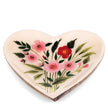 Small heart-shaped dish with floral design on a white background