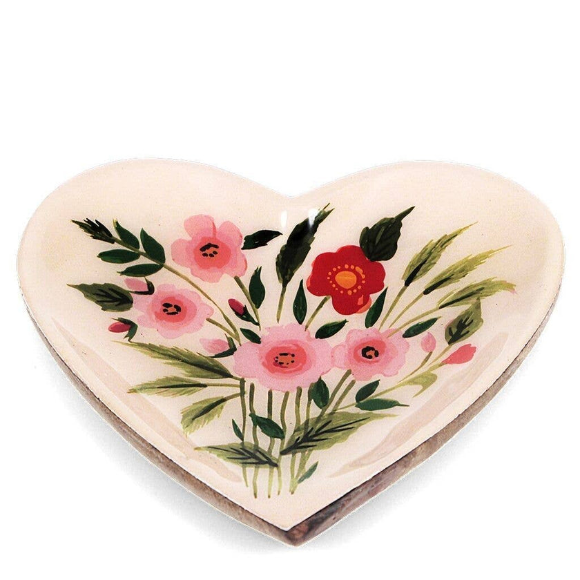 Small heart-shaped dish with floral design on a white background