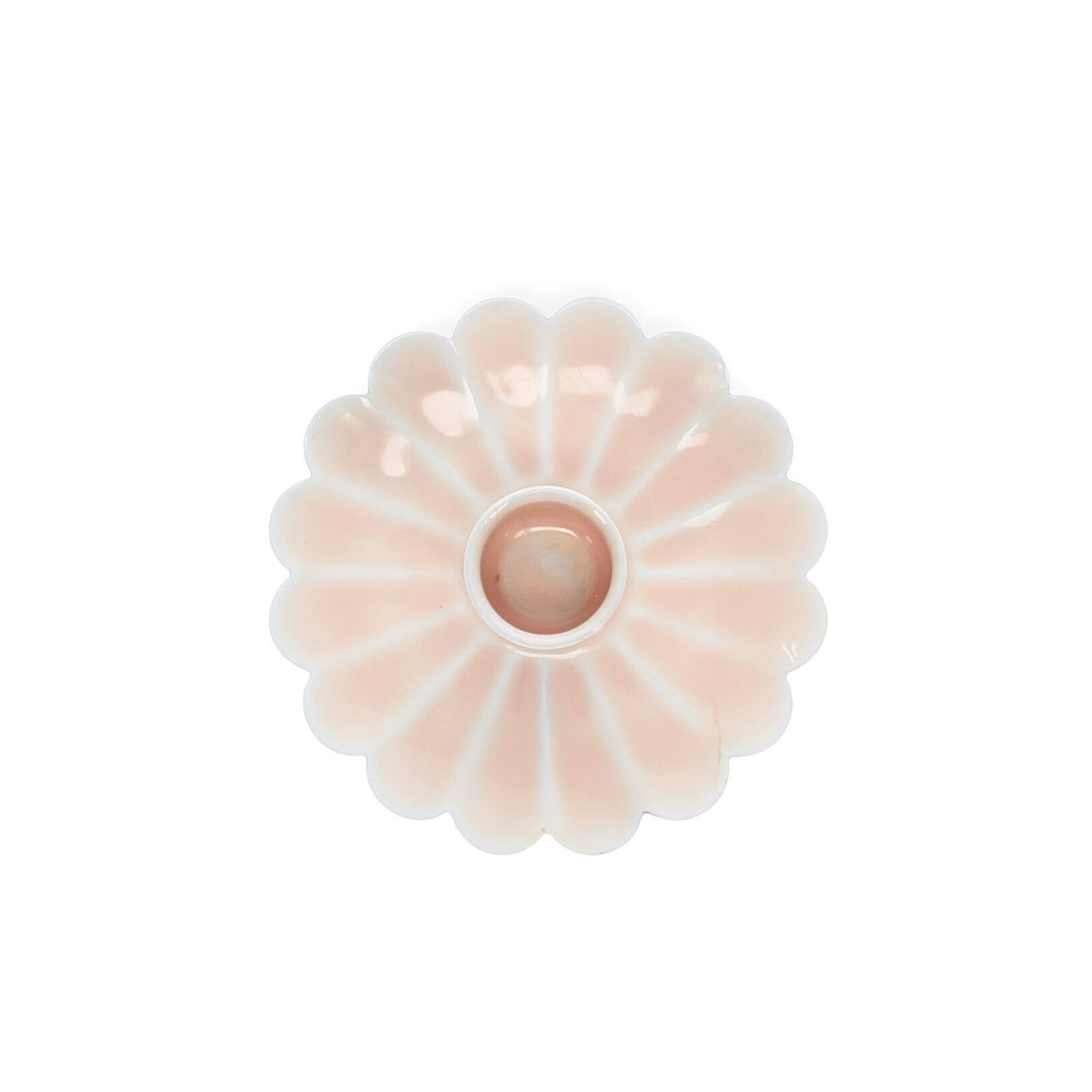 Decorative pink flower-shaped object on a white background