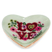Heart-shaped dish with 'LOVE' and floral designs on a white background