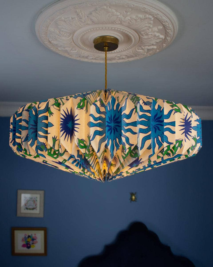 Ceiling lightshade with colourful design against a blue wall