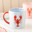 Mug with red lobster design and 'You Are My Lobster' text on a light background