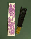 Wild Fig incense sticks with a purple leaf design on a green background
