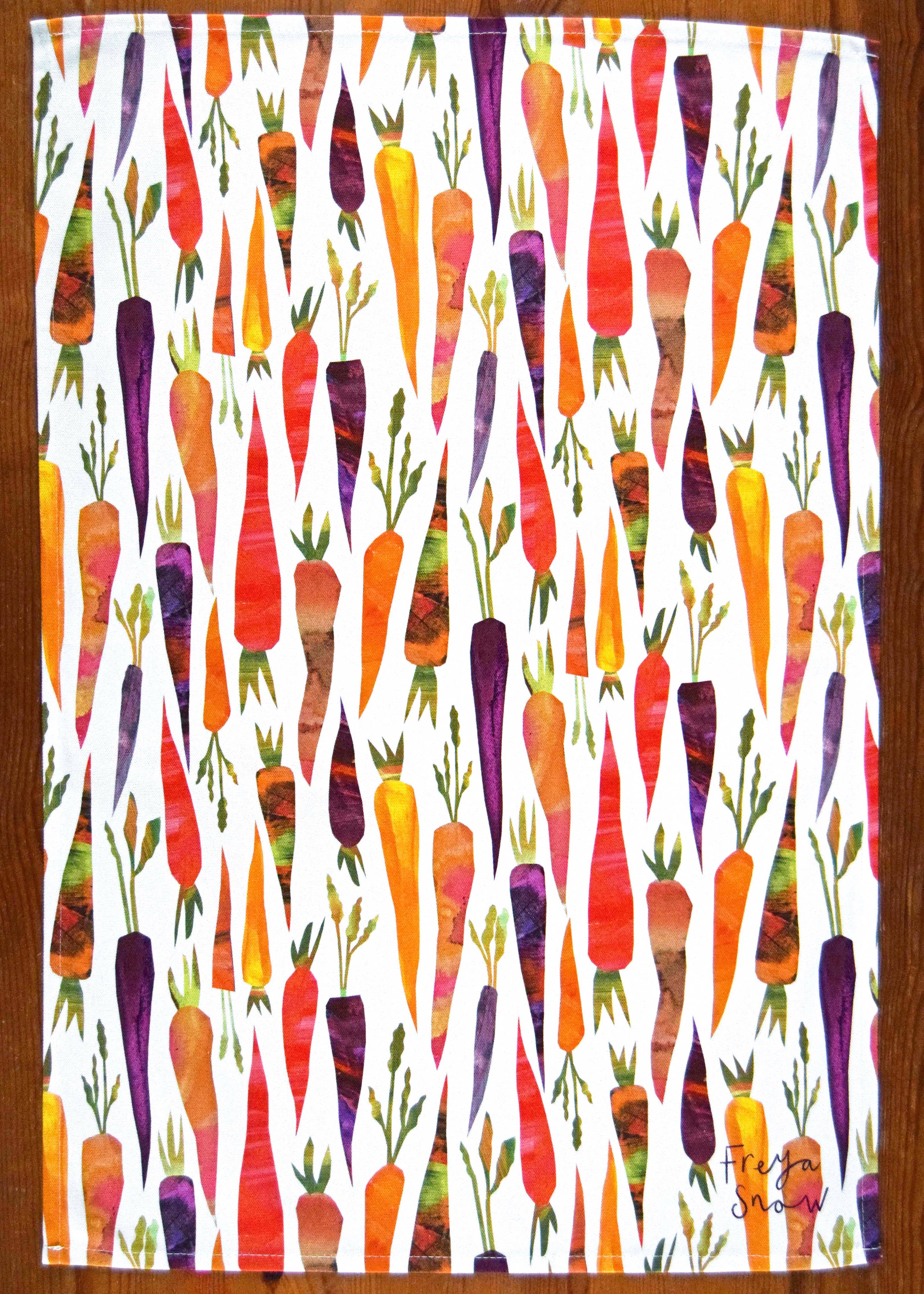 Colorful carrot pattern tea towel on a white background
