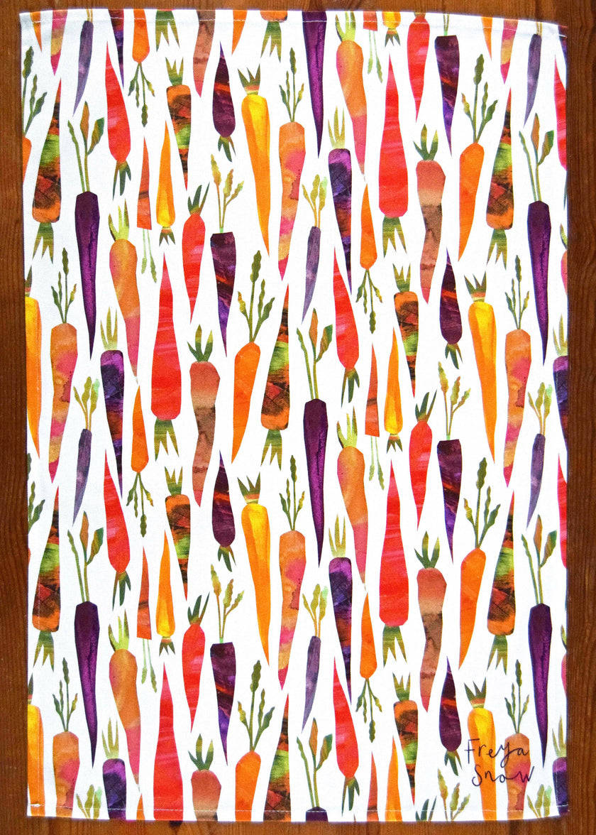 Colorful carrot pattern tea towel on a white background