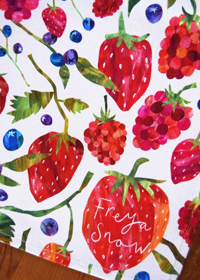 Colorful pattern of strawberries, raspberries, and blueberries with 'Frey a Snow' text on a white background.
