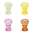 Four colorful glass candle holders on a white background