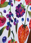 Close-up of a fabric with colorful berry and strawberry pattern
