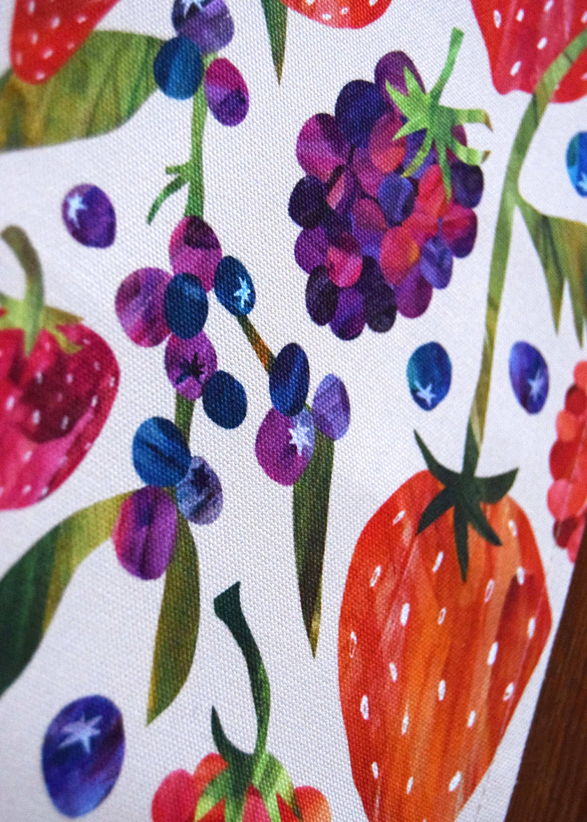 Close-up of a fabric with colorful berry and strawberry pattern