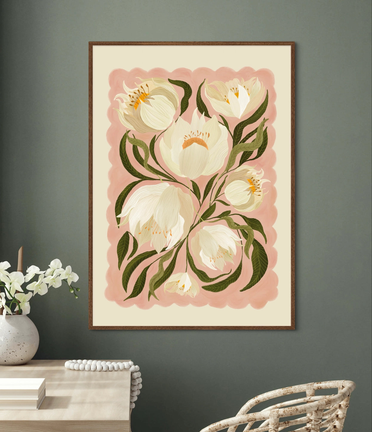 Floral artwork with white peony flowers and green leaves on a pink background, framed in a wooden frame.
