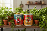 Two colourful storage cans with retro Passata design surrounded by plants 