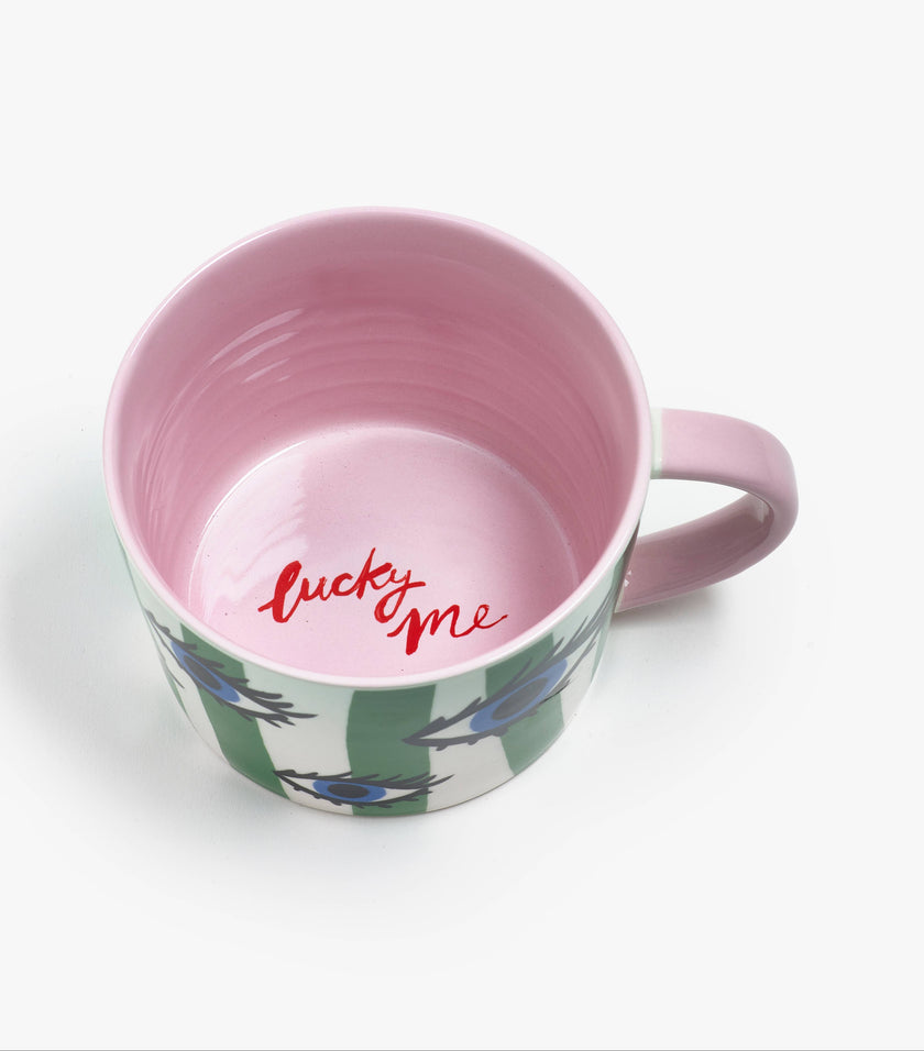 Mug with pink interior and floral exterior on a white background