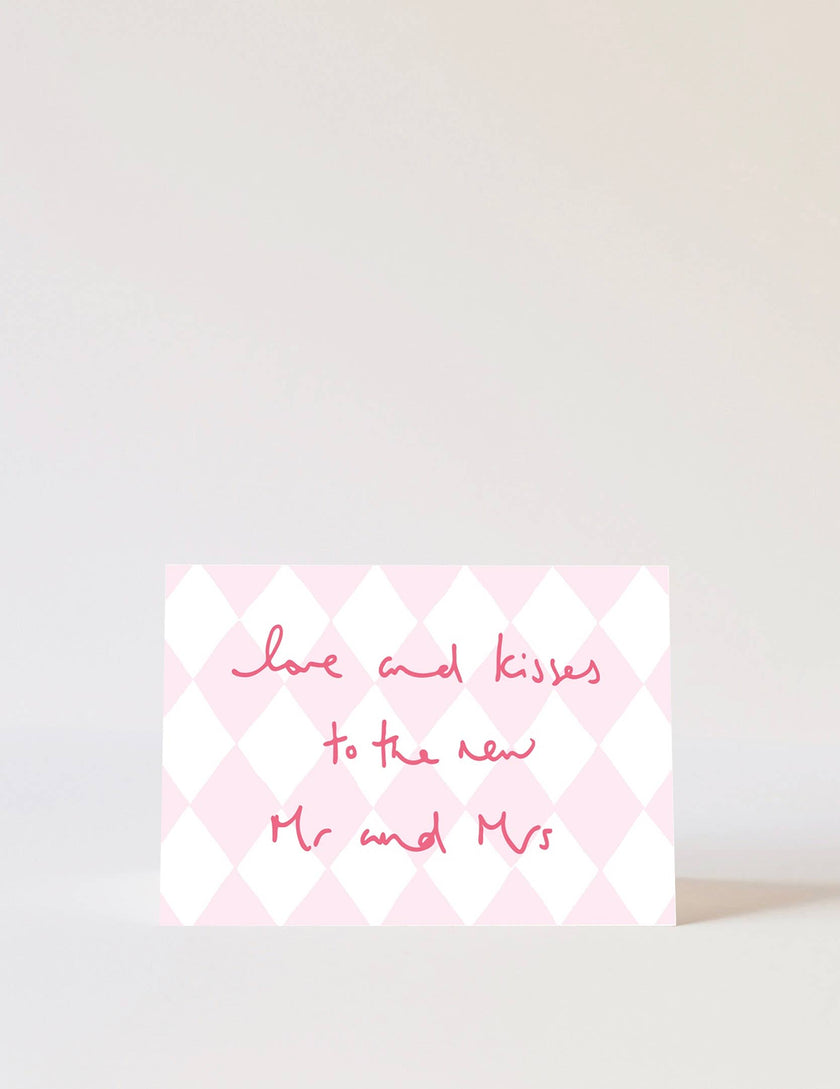 Wedding card with pink and white checkered pattern and text on a light grey background