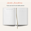 Open notebook with garden inventory pages on a white background