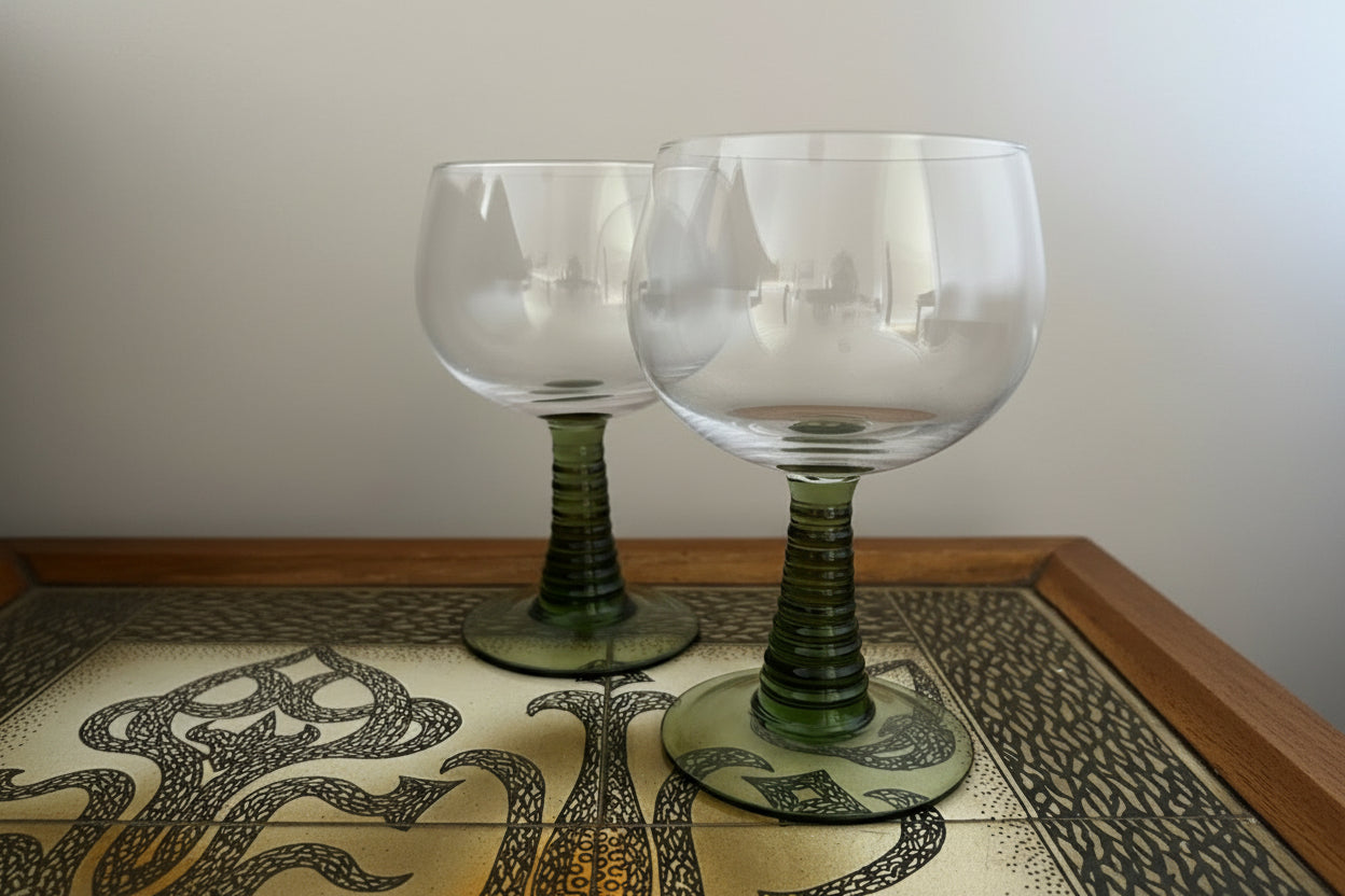 Two green-roemer glasses on a vintage style table