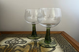 Two green-roemer glasses on a vintage style table