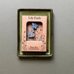 Decorative plant pot companion with floral design in a box labeled 'Lily Faith'.
