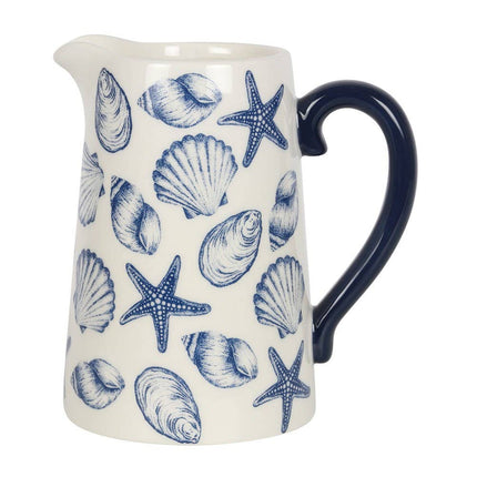 Ceramic pitcher with blue shell and starfish pattern on a white background