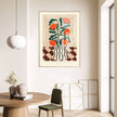Decorative floral painting on a wall above a round table with a chair.