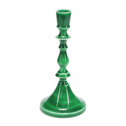 Green candle holder on a white background