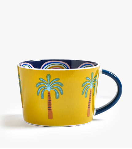 Yellow mug with palm tree design on a white background