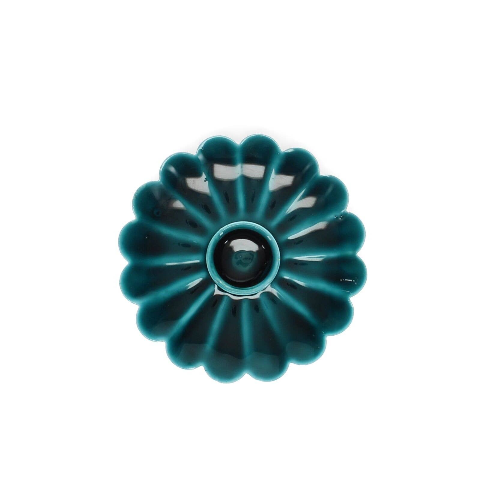 Teal ceramic candle holder on a white background