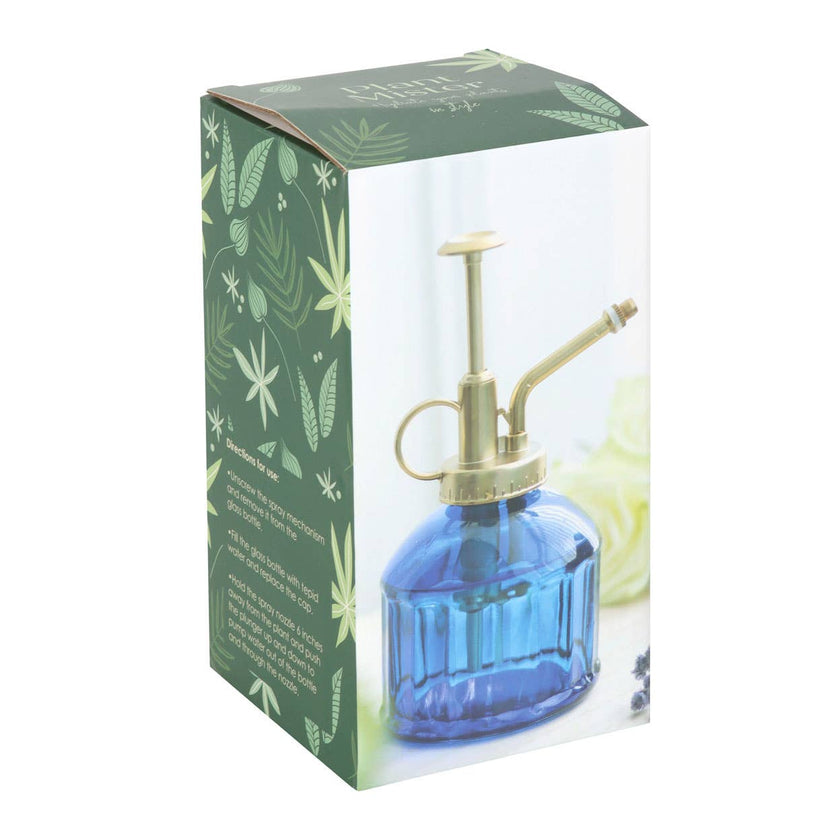 Blue glass spray bottle with brass nozzle in a decorative box